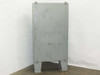 Hammond 1418 T12 enclosure rear exterior – back panel showing painted steel with surface scuffs and scratches, conduit knockouts at top, integral leg base