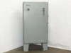 Hammond 1418 T12 Type 12 industrial control panel enclosure – front exterior view, door closed, Allen-Bradley operator handle on right, gray painted steel, on integral floor legs