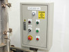 Effluent treatment system control panel labeled 'Effluent Treatment System' with start, stop, emergency stop, and indicator controls