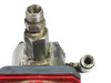 Iwaki EH-C20SH-200R9 pump head close-up showing male NPT discharge fitting and check valve fittings with mineral deposits and wear