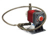 Iwaki EH-C20SH-200R9 metering pump front-left view showing red finned motor housing, stroke length dial, and attached braided stainless hose on base