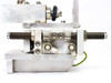 SMC MXS20L-20B — bottom/side view showing dual threaded guide rods, pneumatic port fittings, and base plate mounting holes