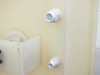 Close-up of two PVC threaded plumbing fittings on the side wall of the PTFE wafer etch bath