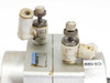 Koganei RANS50-90 top view showing two SMC-style needle valve flow control fittings and quick-connect air ports