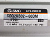 SMC CDQ2KB32-60DM-J79L cylinder label showing model number, max pressure 1.0 MPa, 10.2 kgf/cm², 145 PSI