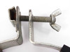 Cherry-Burrell tank bracket clamp – close-up of wing-nut tightening bolt and bracket channel with surface rust