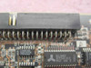 BusLogic BT-946C close-up of PCB label showing model BT-946C, ASSY 1002183, Rev D, and Alliance AS7C164-20JC SRAM chip marking