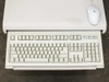 Standard PC keyboard on pull-out tray with Logitech scroll mouse — full keyboard view
