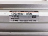 SMC CDQ2KB32-70DM-J79L cylinder — close-up of label showing model number, max pressure 1.0 MPa 10.2 kgf/cm² 145 PSI, and Made in Japan marking