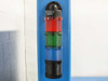Siemens three-color stack light (red, green, blue) mounted on P Energy L150A laminator vertical post – status indicator tower