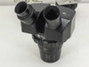 Olympus VMZ stereo zoom microscope head showing VMZ-1 label and Japan marking with binocular eyepiece tubes