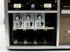 MCR308BTD0X channel module close-up — three VA/111M modules each with Volts/Div selector, Zero knob, REV toggle, and NORM/ZERO switch; power and timing controls above