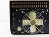 MCR308BTD0X rear panel left section — F1/F2 fuse holders, Power IEC connector, Remote multi-pin connector, Lower TB-Module Output terminal strip, large rear cooling fan with wire guard