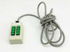 Manual control box 8-key robot pendant front view with green pushbuttons and integrated gray DB15 cable