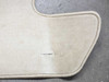 Lexus LX470 cargo mat — corner detail showing serged beige binding and a small snag in the carpet surface