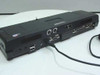 Toshiba Advanced Port Replicator II rear panel showing USB, FireWire, DVI, serial, and parallel ports with AC adapter connected