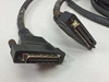 Close-up of interface cable connectors — large multi-pin SCSI-style and smaller connector with locking hardware
