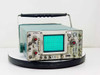 Tektronix 465 oscilloscope front view showing CRT display, CH1 and CH2 controls, and carry handle