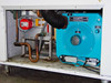 Internal mechanical bay showing Munters Cargocaire blue Honeycombe dehumidifier unit, refrigerant copper lines, and ducting hose