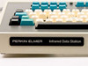 Perkin-Elmer Infrared Data Station nameplate on front bezel with close-up of left key cluster showing ESC, TAB, CTRL, SHIFT LOCK, REPEAT, SHIFT keys