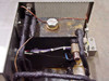 Tecumseh AE9417EG interior close-up showing condenser coil, insulated refrigerant lines, wiring, and fluid port cap