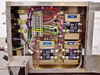 Electrical control box interior showing terminal block, three Crydom D2425 solid state relays labeled Heater and Pump, and multi-color wiring