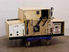 Tegal 701D plasma etcher rear view with covers open showing internal wiring, control boards, high voltage section, and vacuum plumbing