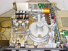Tegal 803 interior top view with cover removed showing reaction chamber, RF matching network coil, gas plumbing, and PCBs