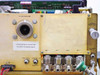 Tegal 803 rear panel close-up showing vacuum pump port, GAS 1–4 manifold connections, coolant in/out, cleaning flow adjust, and warning label