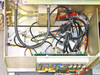 Tegal 803 interior – wiring bay showing control harnesses, gas line fittings, circuit boards including control PCB and fuse/relay board