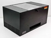 Olite AL100 lighting system – front three-quarter view showing black enclosure housing and top diffuser panel