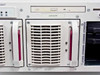 Compaq ProLiant 6400R front panel angled view showing CD-ROM drive, fan bay, and empty hot-plug drive bays