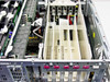 Compaq ProLiant 6400R interior open view showing CPU daughter cards, memory DIMMs, PCI riser, and drive bay area