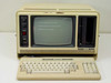 Radio Shack TRS-80 Model 4P – front view with keyboard deployed, CRT displaying floppy error prompt, empty floppy bay at right side of unit
