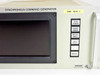 Hughes Synchronous Command Generator front panel close-up — CMD GEN 2 designation, dark CRT display, and five illuminated push-button controls with Hughes Aircraft logo