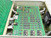 Hughes 3878523-100 interior second view — top-down view of chassis showing full PCB layout with ICs, ribbon cable connections, daughter card assemblies, and rear fan