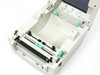 Toshiba TEC B-SV4D – open lid view showing platen roller, media path, and interior mechanism with missing media holder