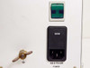 Rear panel close-up showing 220VAc IEC power inlet, green illuminated power switch, and ground lug labeled SECTEUR