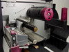 Zebra Z4 label printer internal media and ribbon drive mechanism close-up showing ribbon spool hub and platen roller