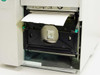 Zebra TLP2746E internal print mechanism – platen roller, ribbon path, and label roll visible with cover open