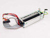 Seiko Instruments LTP5446B-C832 thermal printer mechanism — side view showing flat flex ribbon cable, wiring harness, and metal frame