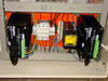 OEM 6200 cabinet interior lower section showing two Digiplan stepper motor drives, circuit breaker, FEA power supply unit, and wiring
