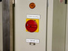 OEM 6200 control cabinet door showing Main Isolator lockout switch (yellow/red), Power On amber indicator, and DB9 connector