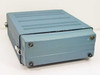 Tekelec TE820B – left side and bottom view of teal benchtop enclosure with rubber feet