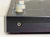 Tele-Images 84386 console – left side panel showing 1/4-inch jack and headset volume knob