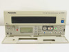 Panasonic AG-RT600P Time Lapse VCR — front panel with cassette door open revealing full transport controls including REW, PLAY, FF, STOP, PAUSE/STILL, REC, RESET, and mode switches