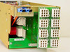 APC MAA-0852 interior right-side view showing green terminal block board with multiple white screw-terminal connectors, blue connector block, transformer or inductor component, and internal PCB