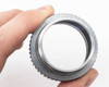 Simpson Optical Perceptordaptor 137-0001 — front aperture view showing clear optical glass element and aluminum inner barrel