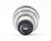 Kodak Cine Ektar 15mm f/2.5 – front element straight-on view showing concentric barrel rings with scuffing and wear on chrome finish