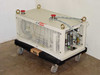 Ebara 40X20 dry vacuum pump front-left view on wheeled transport dolly with red emergency stop buttons and lifting eyes visible on top